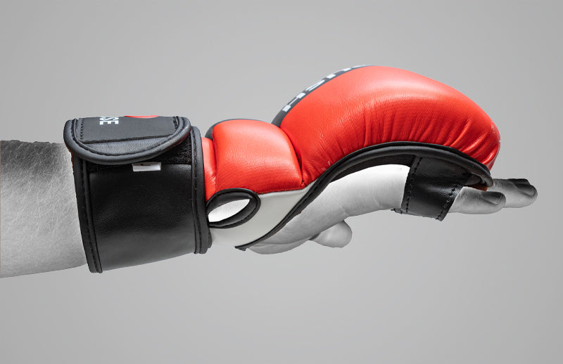 A demonstrating hand showing that DMoose sparring gloves provide protection