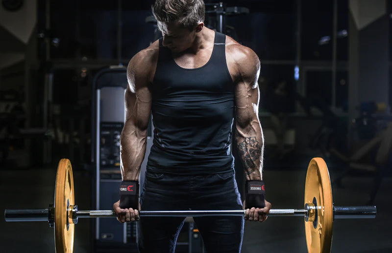 A strong man lifting weight while wearing DMoose crossfit grips on his hands