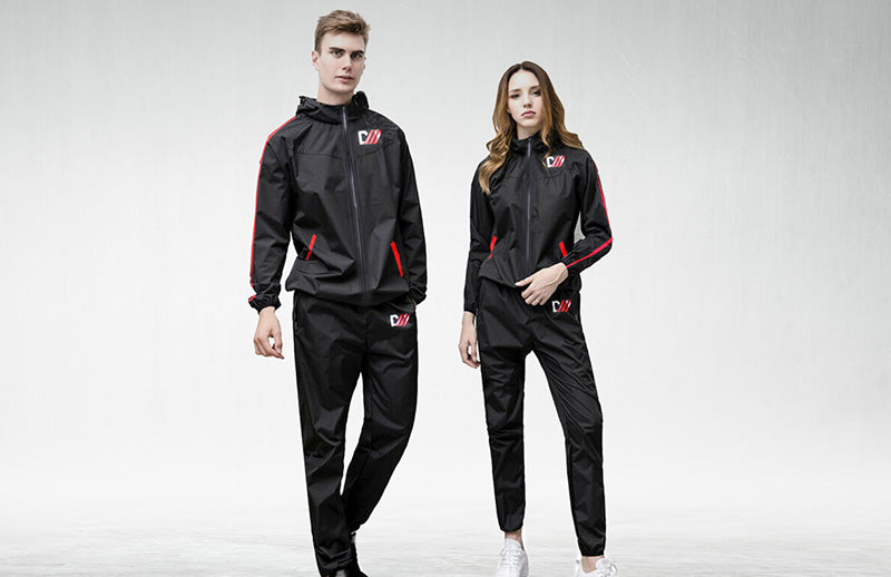 A girl and a boy showing their sauna suit