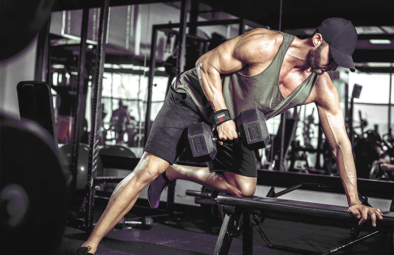 A man doing workout with dumbbell while wearing DMoose crossfit training gloves