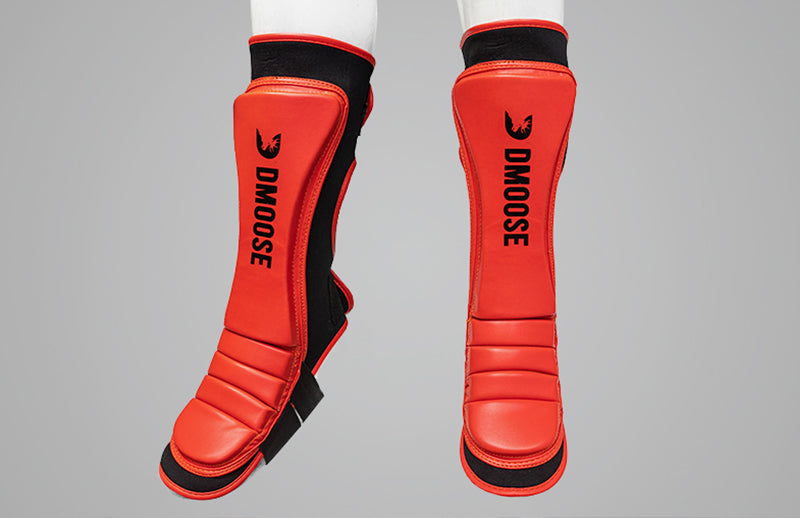 An MMA fighter is kicking with DMoose Shin Guard