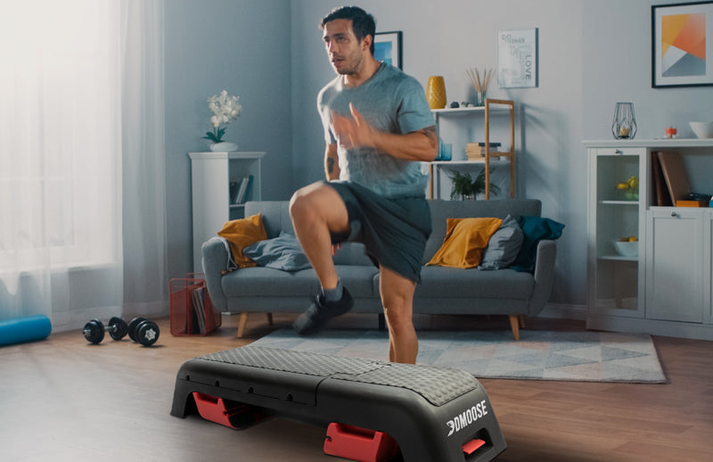 A man working out at home with DMoose deck workout bench