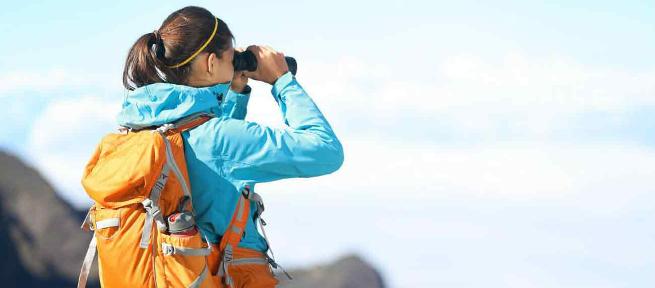 Hiker using binoculars 