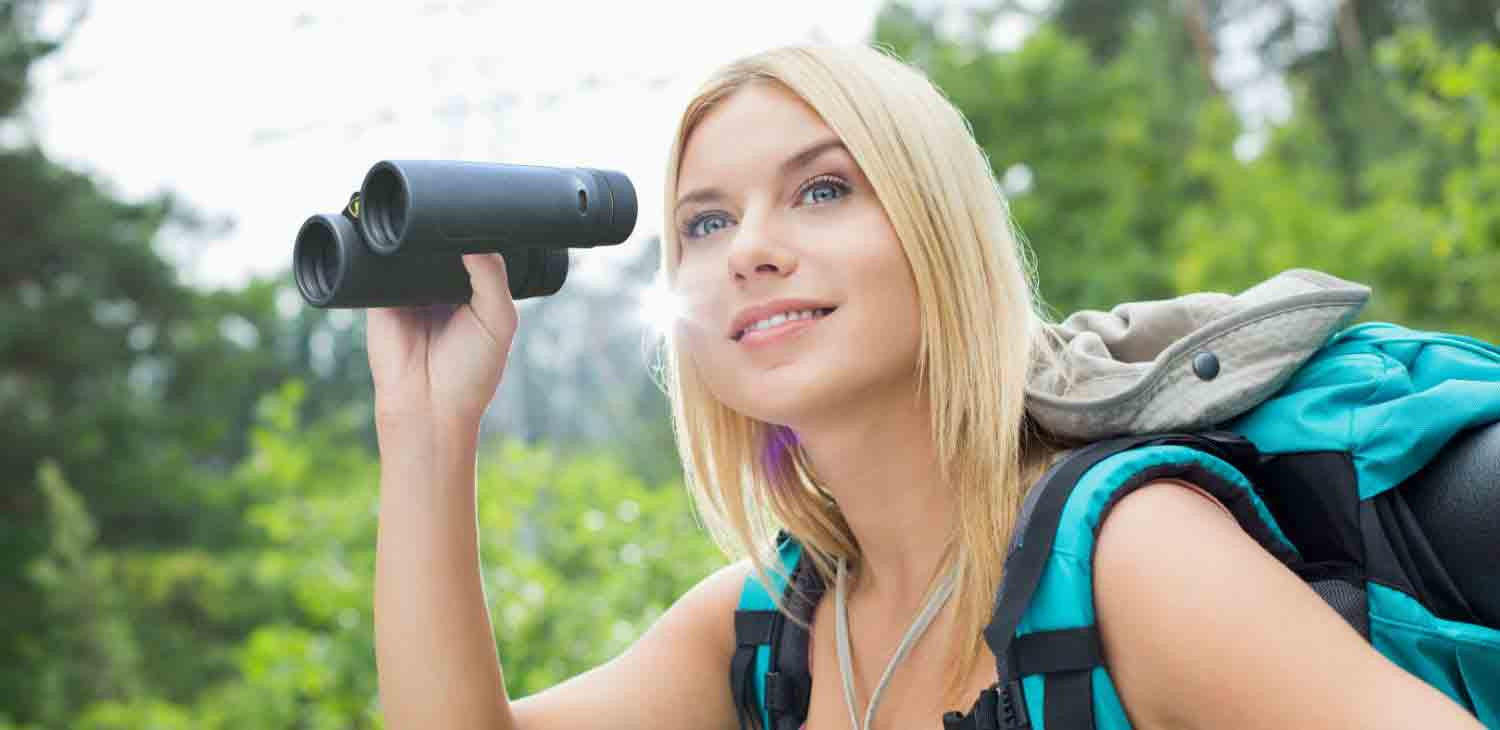 Woman using Vanguard binoculars 