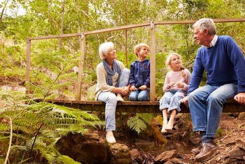 Grandparents sitting with grandkids