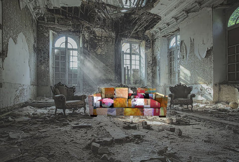 a sara palacios sofa in the middle of an abandone building