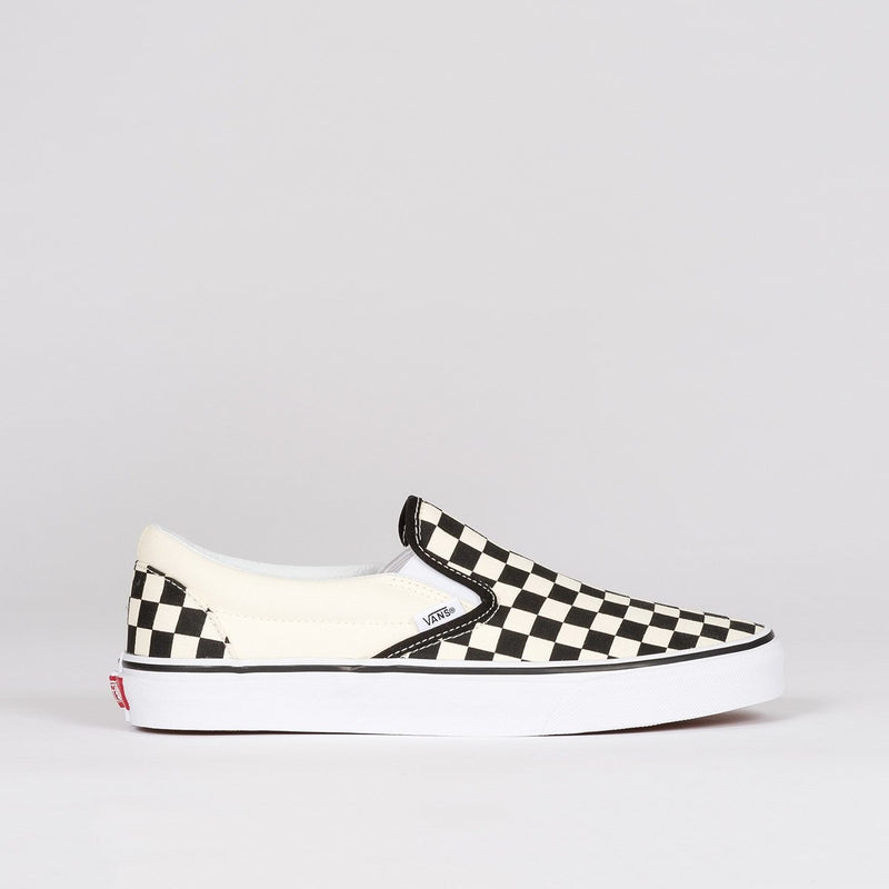 black and white checkered vans slip on