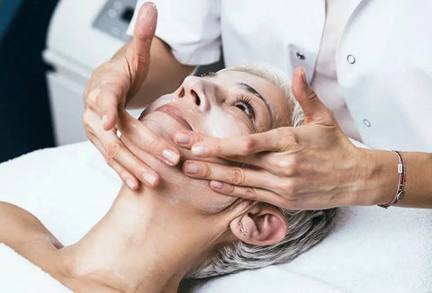 Senior woman having a chemical peel beauty treatment by aesthetician