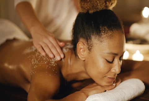 African American woman enjoying a massage before her wedding