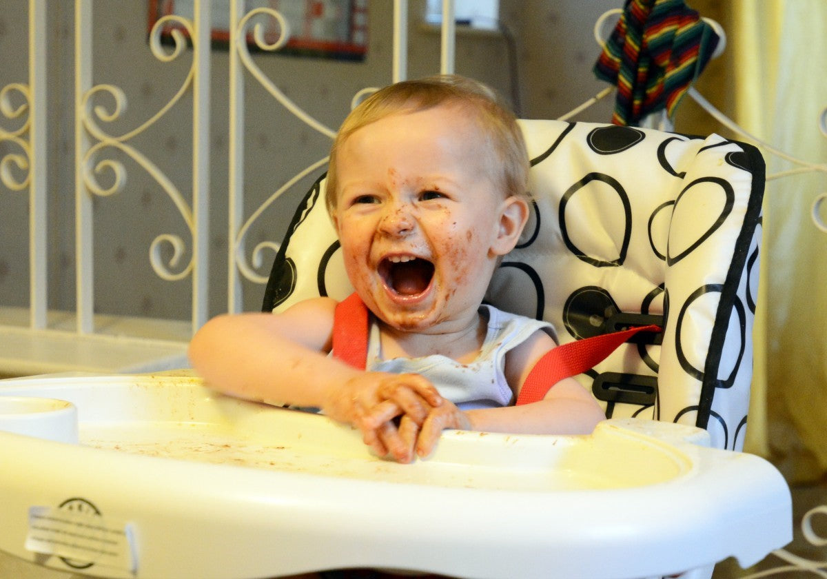 messy child in high chair