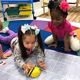 Children programming Bee-Bot