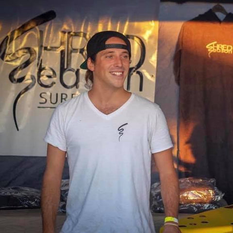 Liam Becker is the founder of Shred Season Surfboard in Charleston, SC. This is him at the Carolina Surf Film Festival after surfing on Folly Beach. 