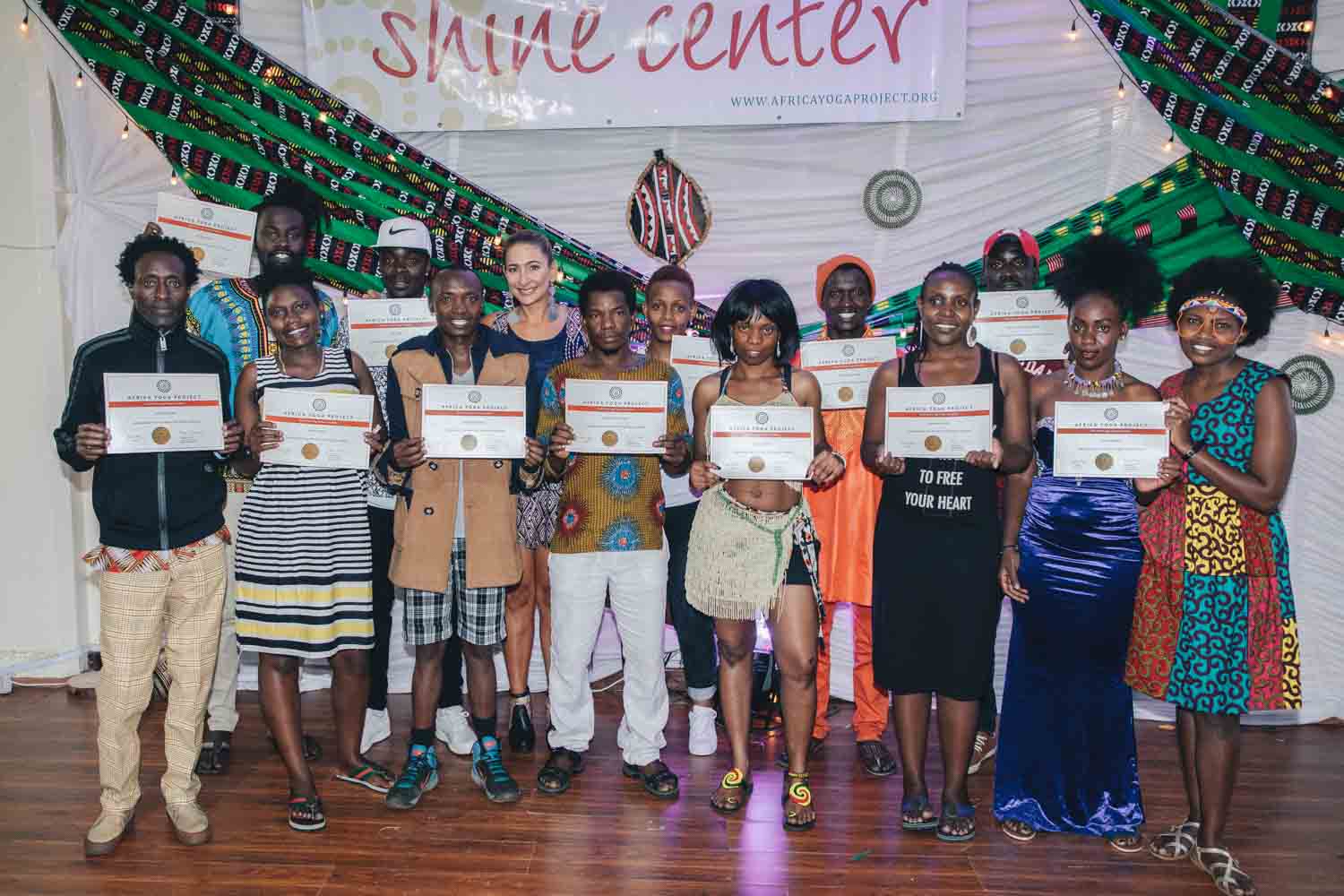 Group of African yoga teachers with their certificates 