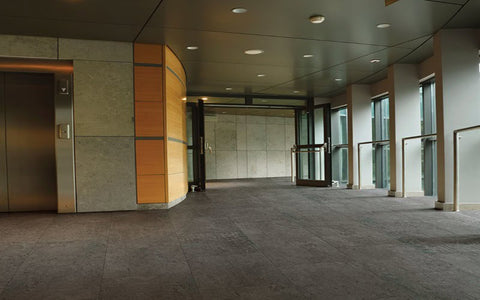 Metroflor Smooth Concrete Anthracite In An Entryway to Elevator Setting