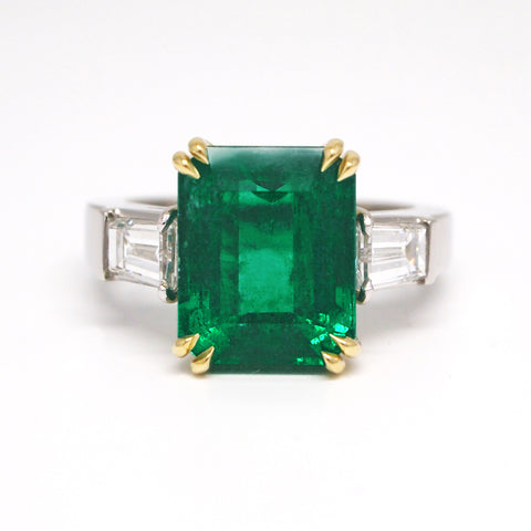 double prong setting custom emerald and diamond ring