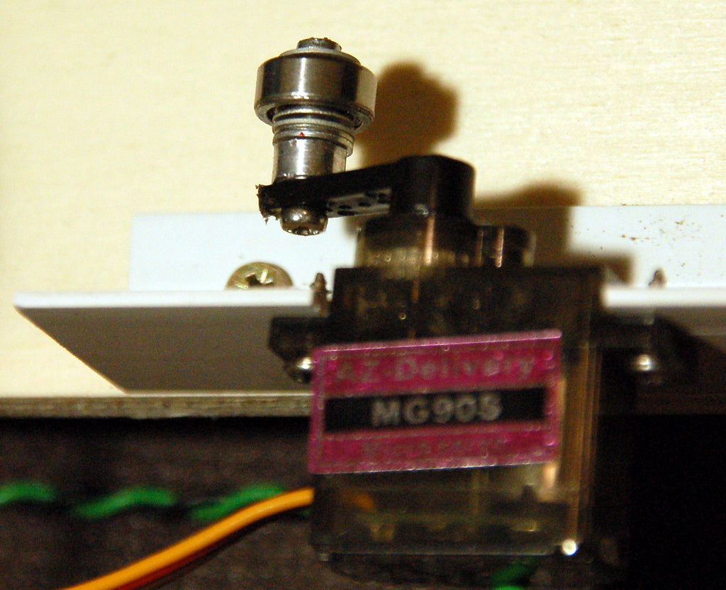 Figure 4: Servo with ball bearing from an old hard drive on the lever