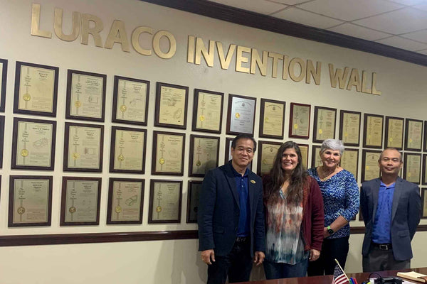 Joanna Walters w/ Luraco co-founders Tom & Kevin Le - Invention Patent Wall