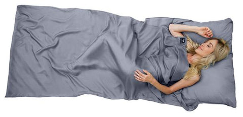Benefits of Sleeping in Brave Era Silk Travel Sheets - Woman in the gray Brave Era travel sheet
