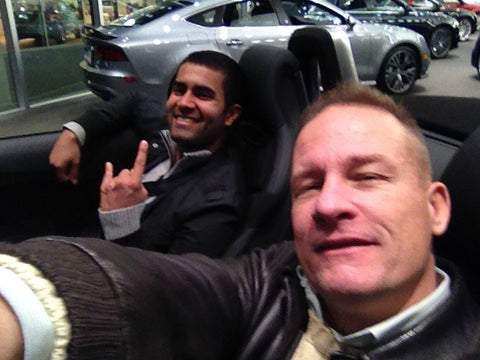 2 Guys in Sports Car wearing Leather jackets