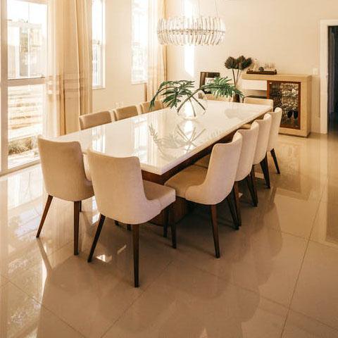 a modern dining room with lighting and furniture