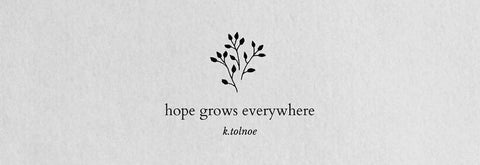 The sentence 'Hope Grows Everywhere' with a floral motif