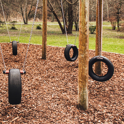 Image of Mixed color bark chippings in a playground