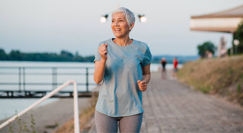 Healthy older woman jogging outdoors
