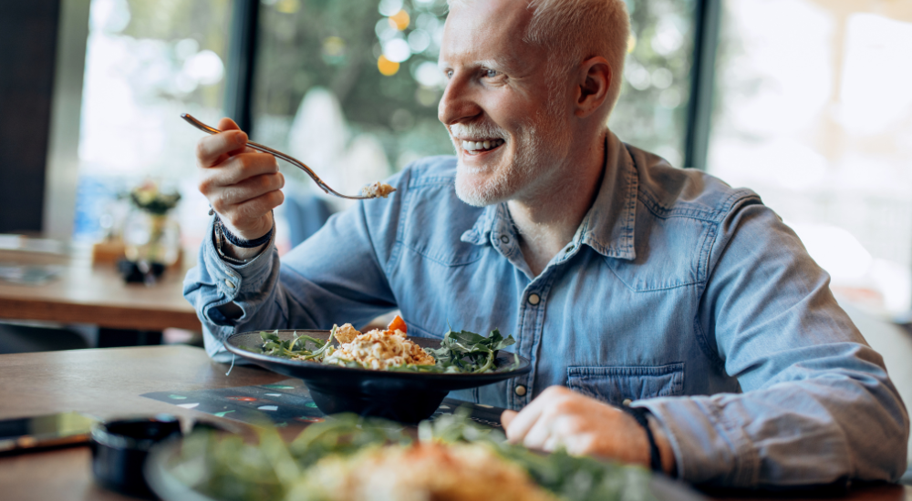Man over 50 eating healthy meal