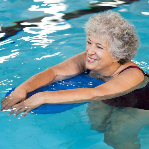 Senior woman swimming on the pool