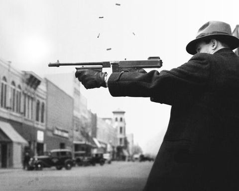 Gangster firing a Tommy gun
