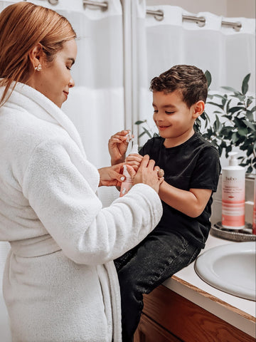 Mom giving son products to help prevent ashy skin