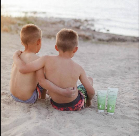 Kids hugging on the beach