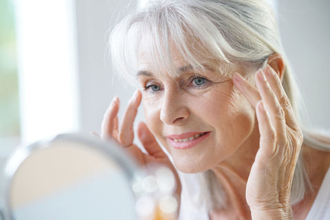 woman using chamomile to minimize signs of aging