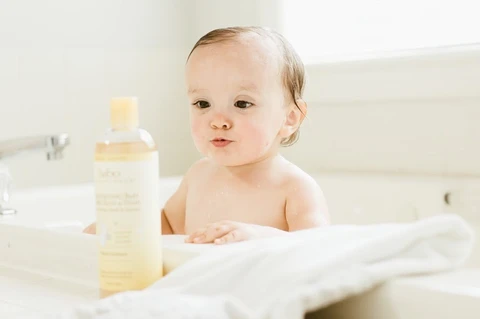 baby taking a colloidal oatmeal bath