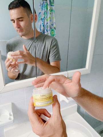 Man moisturizing face to prevent an eczema flare-up