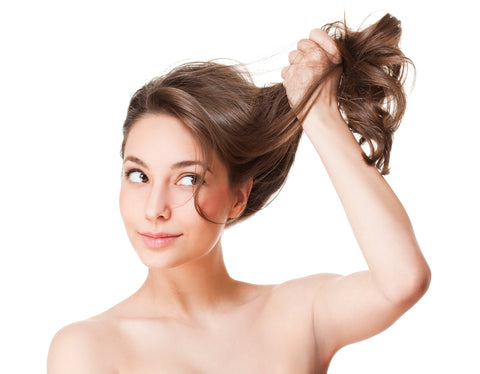 Woman holding up hair with one arm