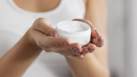 Woman holding miracle cream in hands