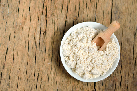 A bowl of ground up oatmeal for an oatmeal bath