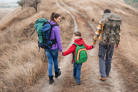 Family out hiking after checking their packing list for vacation