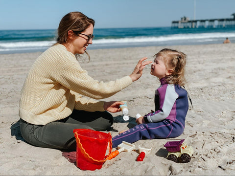 Mom applying sunscreen for sensitive skin on child