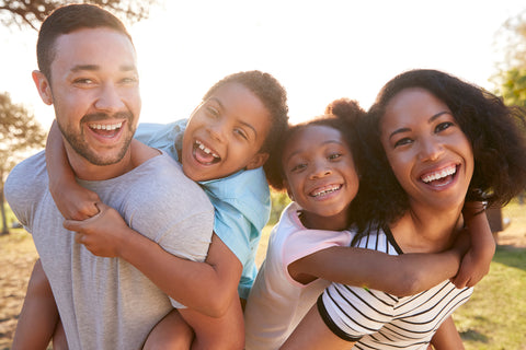 Happy family that uses vegan skin care products