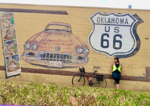 Route 66 mural in OK woman with bicycle and yellow cute reflective high visibility safety vest