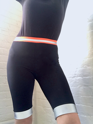 high tech lycra Bike shorts with rainbow sparkle reflective trim and neon orange waist band