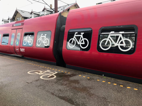 bicycles painted on platform and on a train car dedicated to bicycles in Copenhagen Denmark