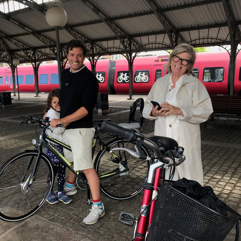 family photo in Copenhagen, Denmark with bikes, returning home by train 