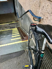 bike at the top of a rail designed to roll bicycles up and down stairs in Copenhagen Denmark