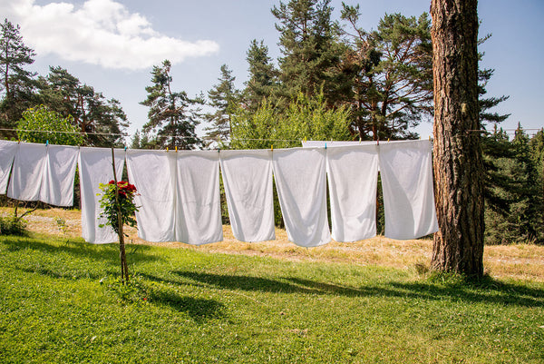 White laundry hanging outside to dry
