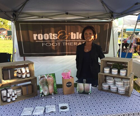 At the farmers’ market selling my first Roots & Bloom products