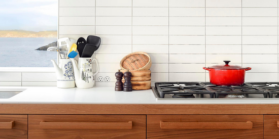 minimal kitchen with a bocci plug discretely hidden by the counter