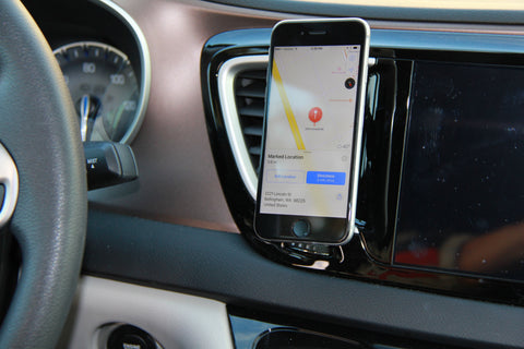 air vent mounted smartphone holder with phone attached
